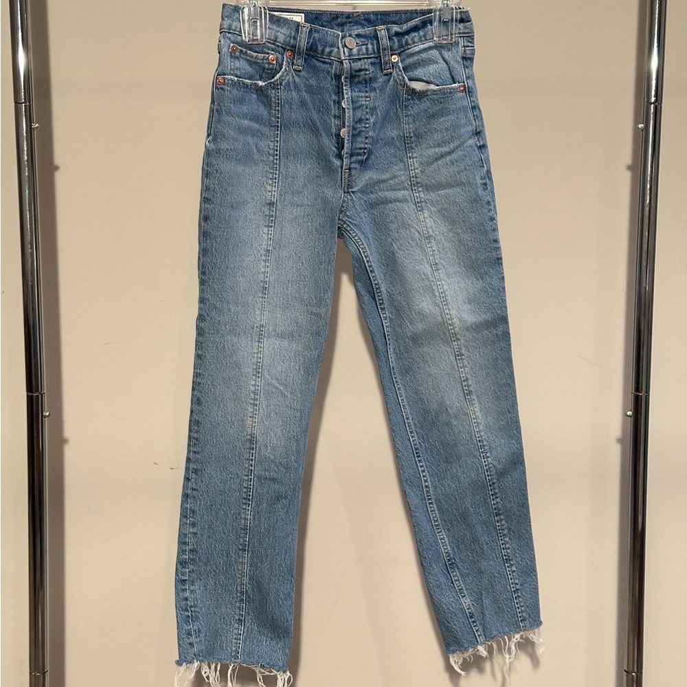 medium wash gap jeans with seam down the front of the leg